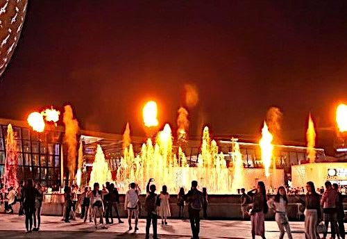 Crowd watching a fire and water fountain show