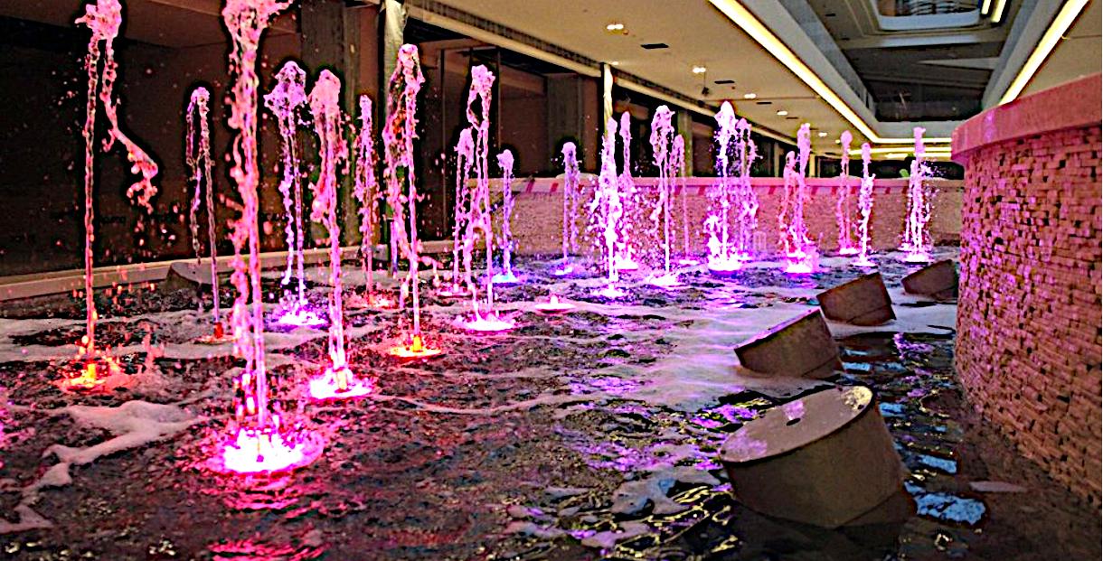 Indoor dancing jets lit pink and purple