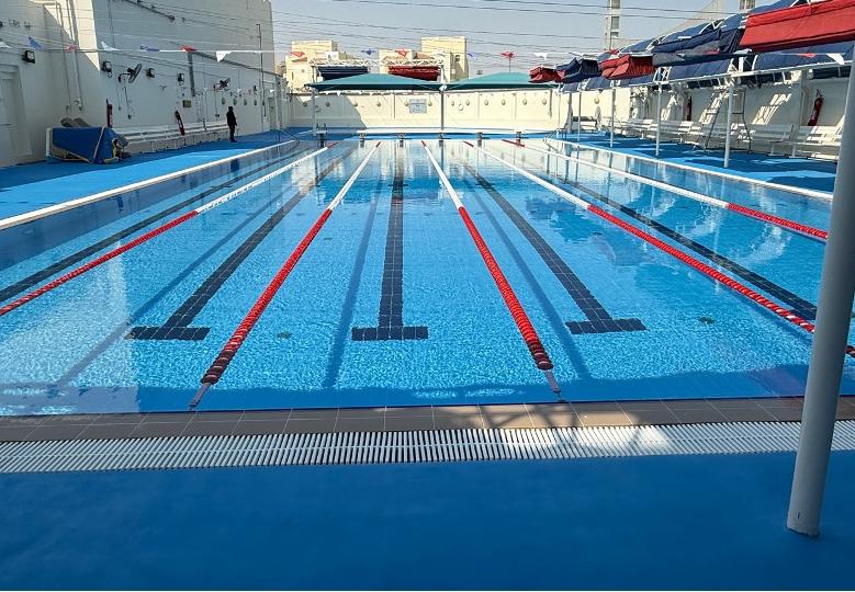 Clean outdoor lap pool with lane markings