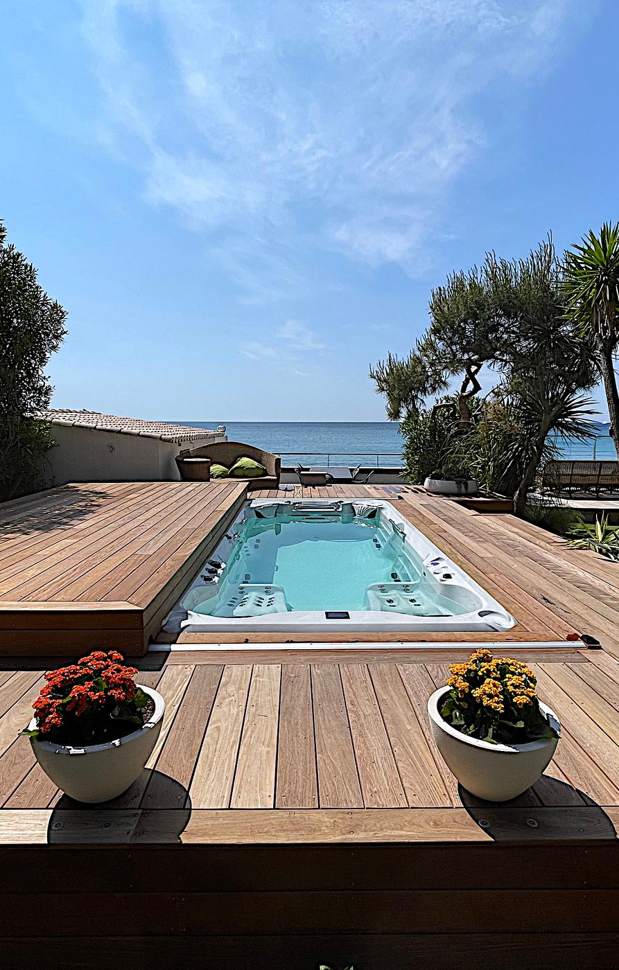 Swim spa on a terrace overlooking the sea