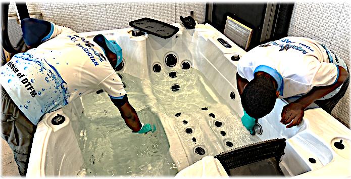 Technicians servicing a jacuzzi shell